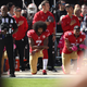 Colin Kaepernick, No. 7, then of the San Francisco 49ers, and teammate Eric Reid, No. 35, kneel in protest during the national anthem prior to their NFL game against the Tampa Bay Buccaneers at Levi’s Stadium in Santa Clara, Calif., on Oct. 23, 2016. (Ezra Shaw/Getty Images)